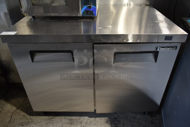 BRAND NEW SCRATCH AND DENT! Bluelinetech BUC48FA Stainless Steel Commercial 2 Door Undercounter Freezer on Commercial Casters. 115 Volts, 1 Phase. Tested and Working! - Image 1 of 7