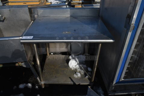 Stainless Steel Commercial Table w/ Metal Under Shelf and Back Splash.