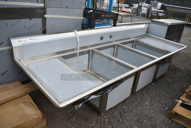 BRAND NEW SCRATCH AND DENT! Regency 600S32030220 Stainless Steel Commercial 3 Bay Sink w/ Dual Drain Boards. Bays 20x30. Drain Boards 18.5x32. No Legs.  - Image 1 of 9