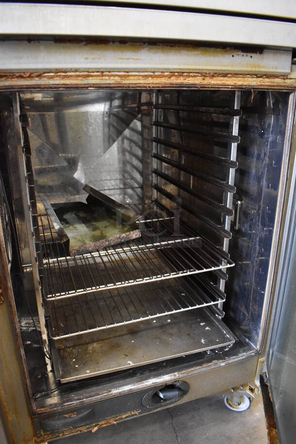 2 2016 Rational Stainless Steel Commercial Combitherm Self Cooking Center Convection Ovens on Commercial Casters. Top Model: SCC WE 62. Bottom Model: SCC WE 102. Picture of Unit Powered on is Included. 480 Volts, 3 Phase. 42x40x73. 2 Times Your Bid! - Image 8 of 9