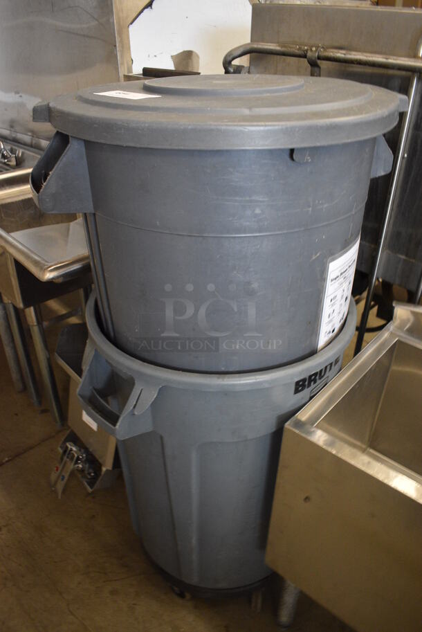 2 Rubbermaid Brute Gray Poly Trash Cans w/ 1 Lid and 1 Trash Can Dolly. Includes 25x23x28. 2 Times Your Bid!