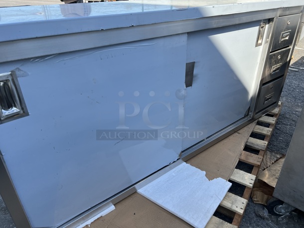 BRAND NEW SCRATCH AND DENT! Regency 600EBT2472R Stainless Steel Commercial 24" x 72" 16 Gauge Type 304 Enclosed Base Sliding Door Table with Drawers - Image 2 of 10