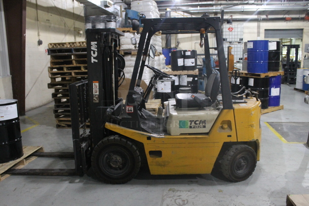 TCM FG20 Metal Commercial Propane Gas Powered Riding Forklift. Hours Read 1,550. BUYER MUST REMOVE: This Item CANNOT Be Transported; Must Pick Up By Appointment Only Approximately 1 Week After Auction Ends; Forklift Will Be Used During Pick Up Day. - Image 1 of 12