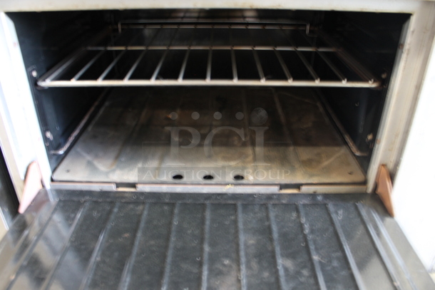 Garland S-6-26 Stainless Steel Commercial Natural Gas Powered 6 Burner Range w/ Oven, Over Shelf and Back Splash.  - Image 4 of 6