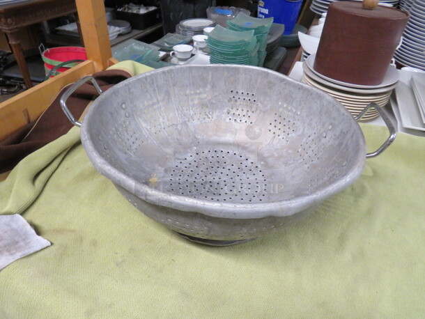 One 16 Inch Aluminum Collander.