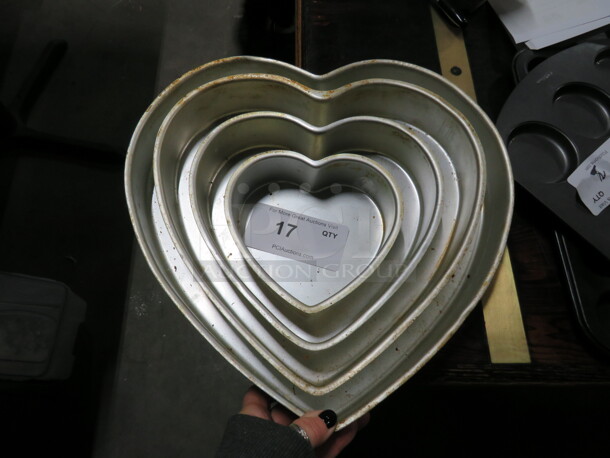 One Set Of Heart Shaped Cake Pans.