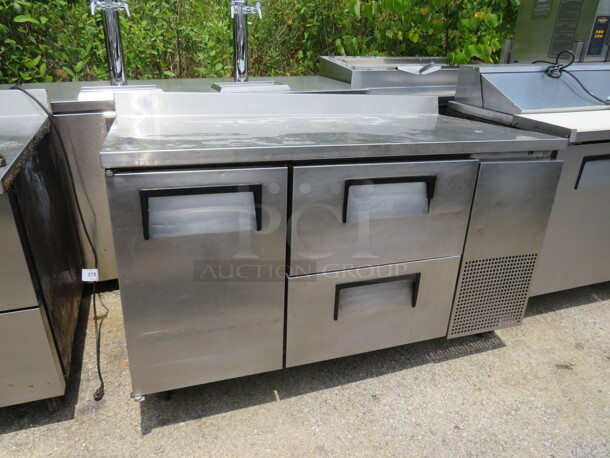 One True 1 Door 2 Drawer Worktop Refrigerator With 2 Racks, And Backsplash On Casters. 115 Volt. Model# TWT-60-32D-2. 60X33X40. $4991.00 - Image 1 of 3