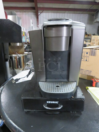 One Keurig Coffee Brewer With 1 Drawer Metal Holder. Missing Water Tank Top. 