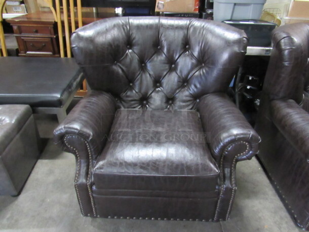 One AWESOME Brown Leather Look Over Stuff Chair. VERY COMFY
