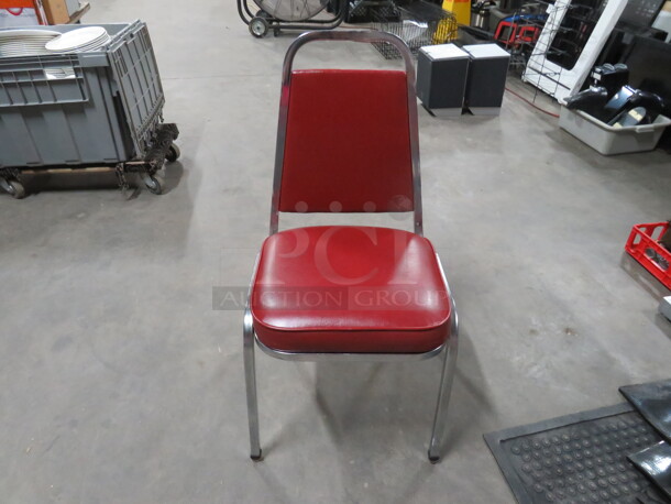 Chrome Stack Chair With Red Cushioned Seat And Back. 5XBID