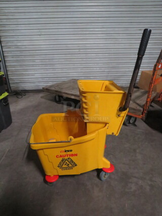 One Mop Bucket And Wringer.