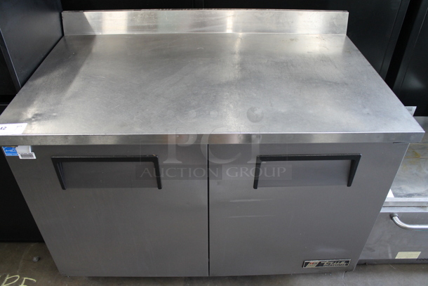 True TWT-48 ENERGY STAR Stainless Steel Commercial 2 Door Work Top Cooler on Commercial Casters. 115 Volts, 1 Phase. Tested and Powers On But Does Not Get Cold - Image 1 of 7