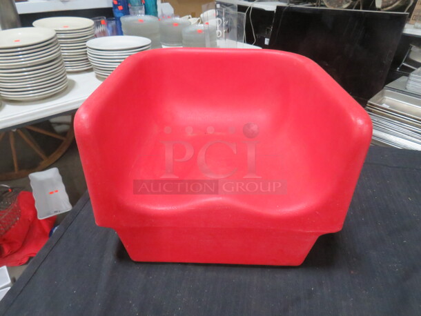 One Cambro Red Booster Seat.
