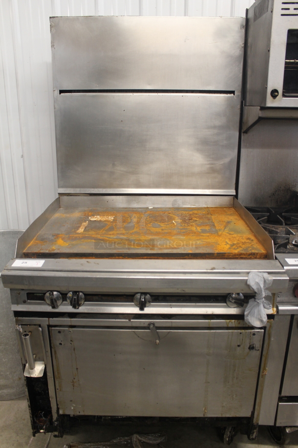 Jade Range Commercial Stainless Steel Natural Gas Powered Griddle Range With Convection Oven With Pan Racks On Commercial Casters. - Item #1057968