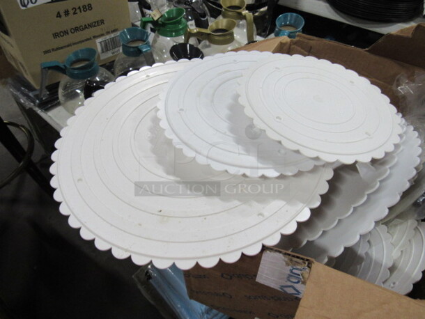 One Lot Of Assorted Size Wilton Cake Plates.