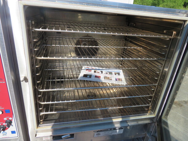 One Blodgett Full Size Electric Combi Oven With 5 Racks, And Manuals, On Stand. Model# BCX-14E. 208 Volt. 3 Phase. 40X41X56. $29,397.75. - Image 4 of 5