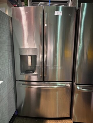 GE 36" Top/Bottom Stainless Steel Residential Refrigerator. Excellent condition , like new! 70" H x 36" W x 27" D