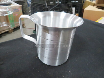 One NEW 1 Quart Aluminum Measurer.