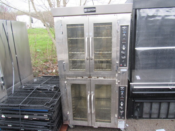 One Doyon Double Oven With 6 Racks On Casters. 120/208 Volt. 3 Phase. Model# JA14. 38X36X73