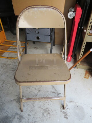 Beige Metal Folding Chair. 4XBID