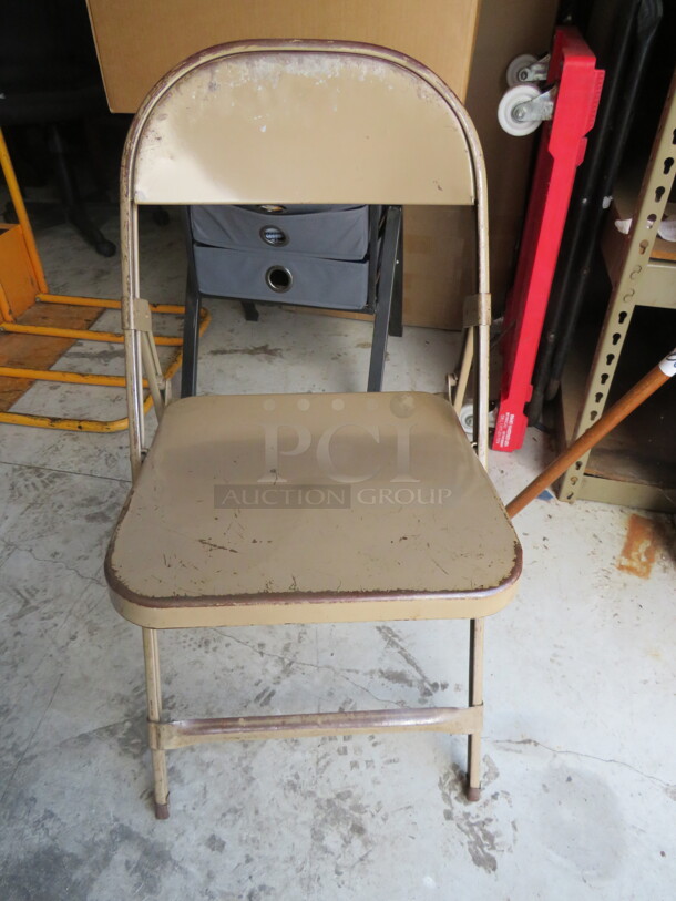 Beige Metal Folding Chair. 4XBID - Item #1110979