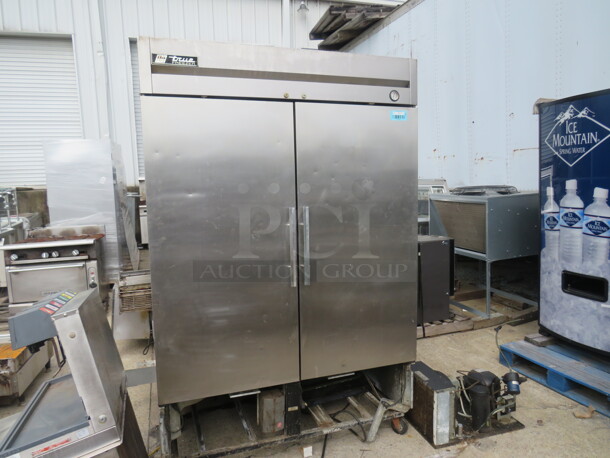 One Stainless Steel True 2 Door Freezer on Casters. Model# T-49F. No Bottom Plate. Compressor Needs to Be Attached. 54X30X82