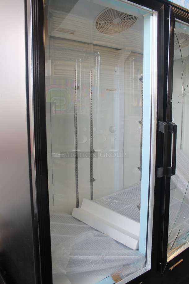 BRAND NEW SCRATCH AND DENT! 2023 Avantco 178GDC69HCB 78 1/4" Black Metal Commercial 3 Door Cooler Merchandiser with LED Lighting and Poly Coated Racks. 115 Volts, 1 Phase. Tested and Powers On But Does Not Get Cold - Image 3 of 8