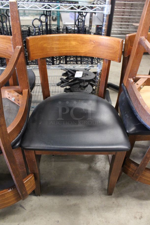 4 Wooden Dining Height Chairs w/ Black Seat Cushion. Stock Picture - Cosmetic Condition May Vary. 17x19x31. 4 Times Your Bid!