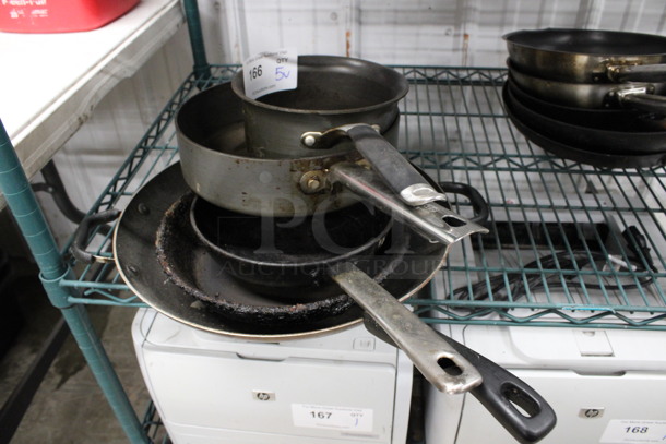 5 Various Metal Items; 2 Sauce Pots and 3 Skillets. Includes 14x7.5x3.5. 5 Times Your Bid!