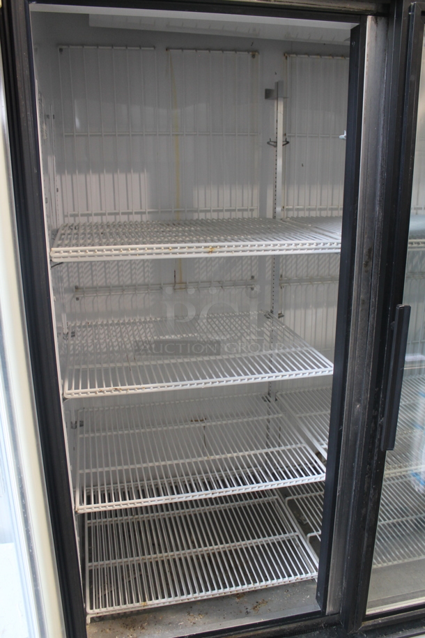 2012 True GDM-72F Commercial Three Swing Door Merchandiser Freezer With Polycoated Racks. 115/208-230V, 1 Phase.  - Image 4 of 7