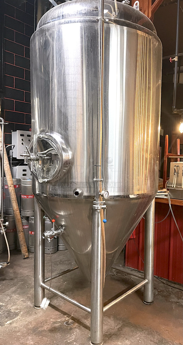 ? ?  BEAUTIFUL!! Stout Tanks & Kettles - 15 BBL Fermenter / Unitank (Jacketed). ? ?                 Features: Easily Converts to a Unitank or Brite Serving Tank;
Glycol Jacketed - 2 Zones: Cone and Sidewall; 
Shadowless Manway for Easy Cleaning;
Adjustable Racking Arm for Clear Transfer;
1.5" Sample Valve for Quality Testing;
Back Mounted Pressure Gauge;
Adjustable Feet for Leveling on Uneven Floors or Fine Height Adjustments;
Pressure Gauge Type:  Back Mount;
CIP Arm and 2.5" Rotating CIP Spray Ball;
2 Butterfly Valves;
Rated to 2-Bar (29 PSI);
1/2" NPT Welded Thermowell for Contactless Temperature Probe
Tank Thickness: 3mm
Jacket and Outer Shell Thickness: 2mm.
Cone: 60 degree Interior Angle.
51.5-in. diameter x 125-in.H. - Image 1 of 8