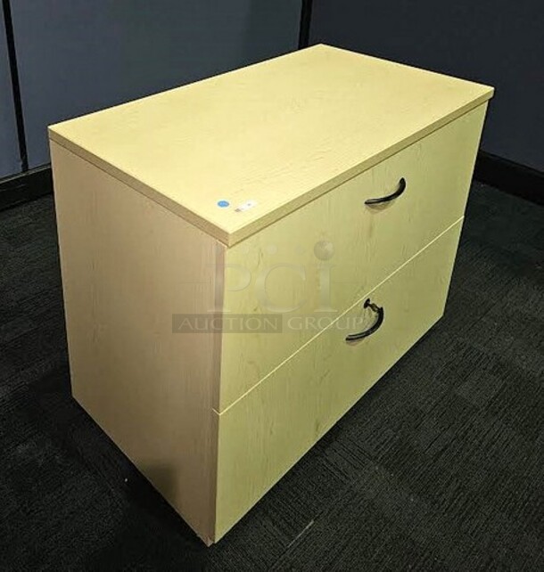 Oak locking lateral file with two drawers and drawer pulls. In like-new condition! 30"H x 36"W x 20"D. 

  - Image 2 of 3