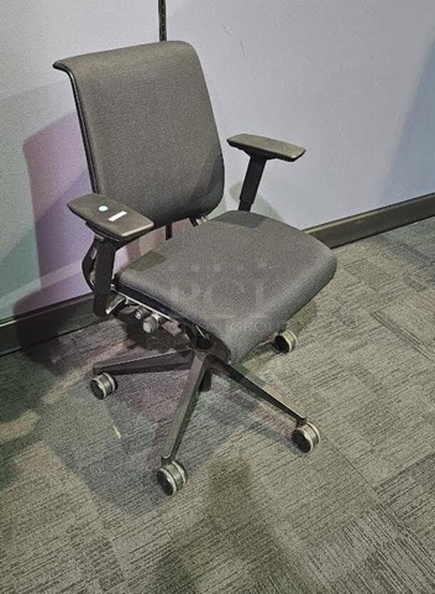 Black Steelcase office desk chair with armrests, black framing and wheels. Adjustable and in good condition! Shows normal signs of use. Measures 41” H x 26.5” W.  - Image 2 of 3