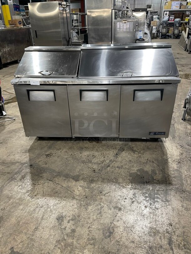 True Mega Top Sandwich/Salad Prep Table! All Stainless Steel! With 3 Door Refrigerated Storage Underneath! With poly Coated Racks! 115V 1 Phase! On Casters! Model: TSSU-72-18 SN: 1-4477571!  - Image 1 of 11