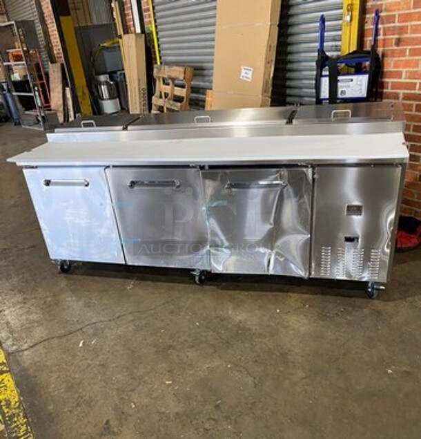 NICE! SCRATCH-N-DENT! Kelvinator Commercial Refrigerated Pizza Prep Table! With Commercial Cutting Board! With 3 Door Storage Space Underneath! All Stainless Steel! On Casters! Model: KCHPT9212 SN: 93610053 115V - Image 1 of 12