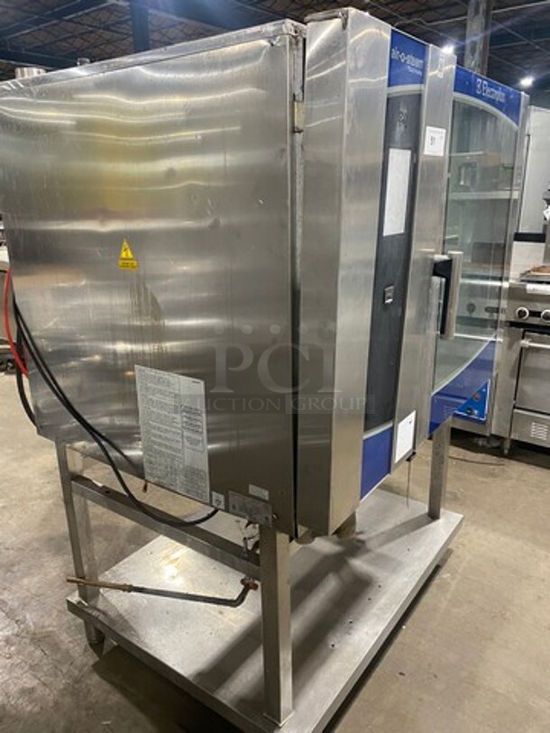 WOW! Electrolux Air-O-Steam Natural Gas Touch Line Combi Convection Oven! With View Through Door! Metal Oven Racks! With Open Underneath Storage Space! All Stainless Steel! On Legs! Model: AOS102GTP1 SN: 20404001 - Image 2 of 12