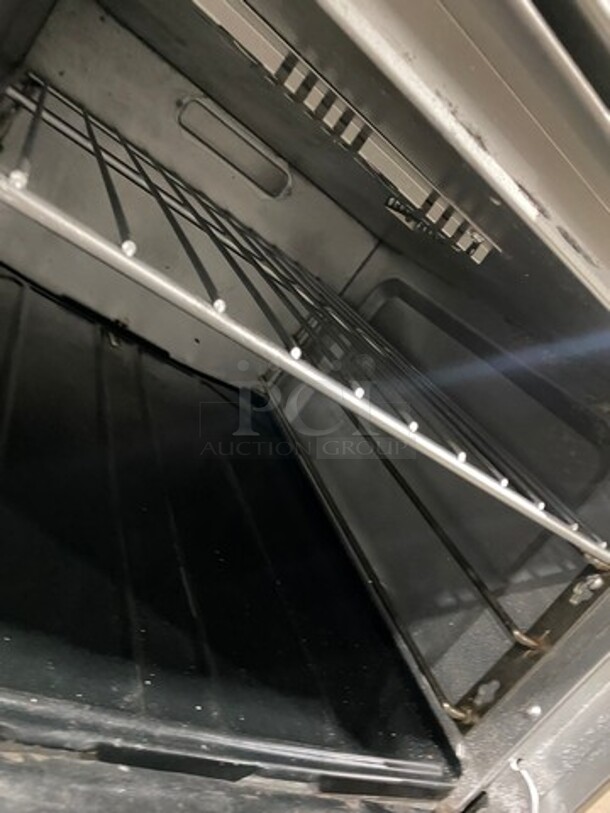 Commercial Natural Gas Powered 4 Burner Stove! With Raised Back Splash! With Oven Underneath! Stainless Steel Body! On Casters! - Image 8 of 10