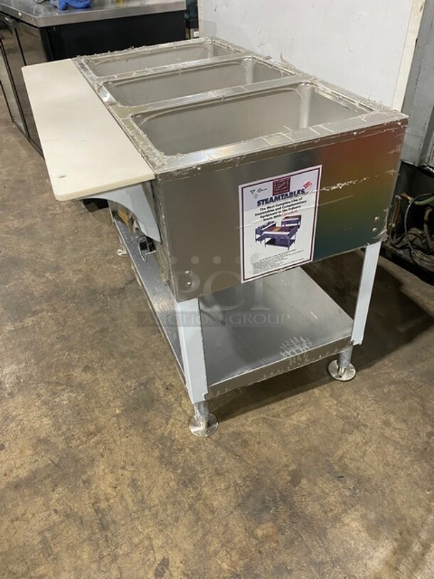NEW! NEVER USED! Duke Commercial Electric Powered 3 Well Steam Table! With Storage Space Underneath! With Commercial Cutting Board! All Stainless Steel! On Casters! Model: E303M SN: 03041770! 208V 3 Phase! - Image 3 of 9