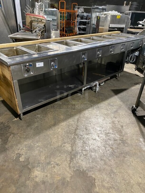 NICE! Wells Commercial Electric Powered 8 Well Steam Table! With Storage Space Underneath! All Stainless Steel With Wooden Outline! Model: HWSMP6D SN: BITTD1109A0164 208V 60HZ 1 Phase