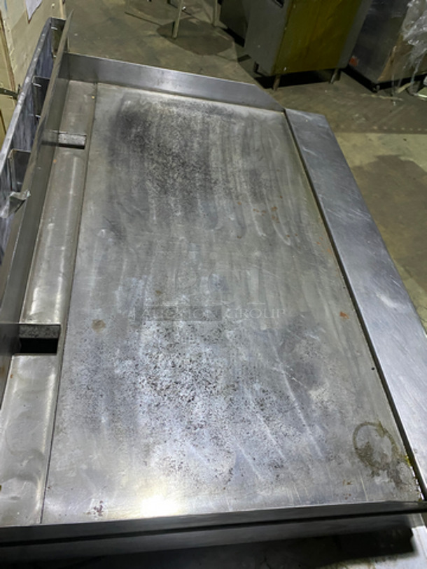 MUST HAVE! Garland Commercial Countertop Natural Gas Powered Heavy Duty Plancha Flat Grill! With Back And Side Splashes! On Heavy-Duty Stainless-Steel Equipment Stand! With Underneath Storage Space! On Casters! - Image 5 of 9