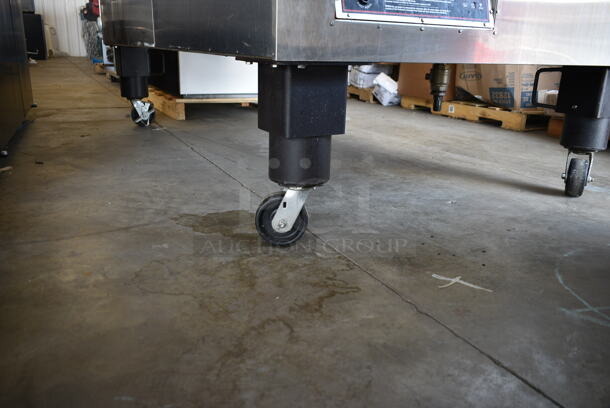Southern Pride SP-750 Stainless Steel Commercial Floor Style Natural Gas Powered Smoker on Commercial Casters. 150,000 BTU.  - Image 8 of 10