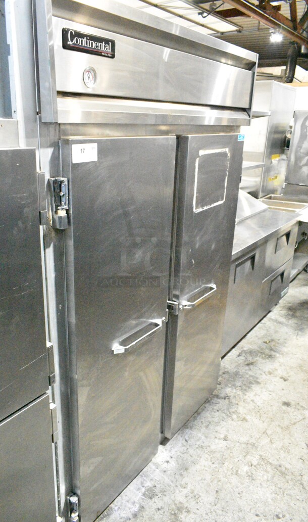 Continental 2F Stainless Steel Commercial 2 Door Reach In Freezer w/ Poly Coated Racks. 115 Volts, 1 Phase. Tested and Powers On But Does Not Get Cold
 - Image 1 of 6