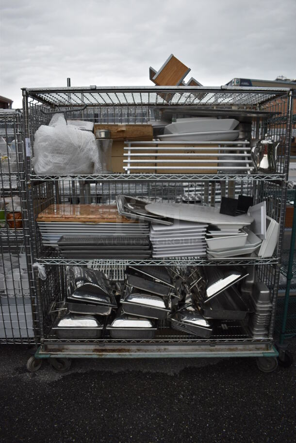 ALL ONE MONEY! Lot of Chrome Finish 4 Tier Shelving Unit on Commercial Casters w/ All Contents Including Metal Drop Ins, White Ceramic Plates. BUYER MUST DISMANTLE. PCI CANNOT DISMANTLE FOR SHIPPING. PLEASE CONSIDER FREIGHT CHARGES. 60x25x72