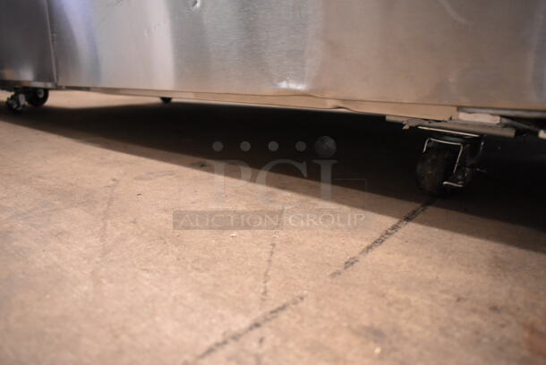 BRAND NEW SCRATCH AND DENT! 2023 Avantco 178SSWT60FHC Stainless Steel Commercial 2 Door Work Top Freezer on Commercial Casters. Right Door Does Not Stay Closed. 115 Volts, 1 Phase. Tested and Working! - Image 3 of 7