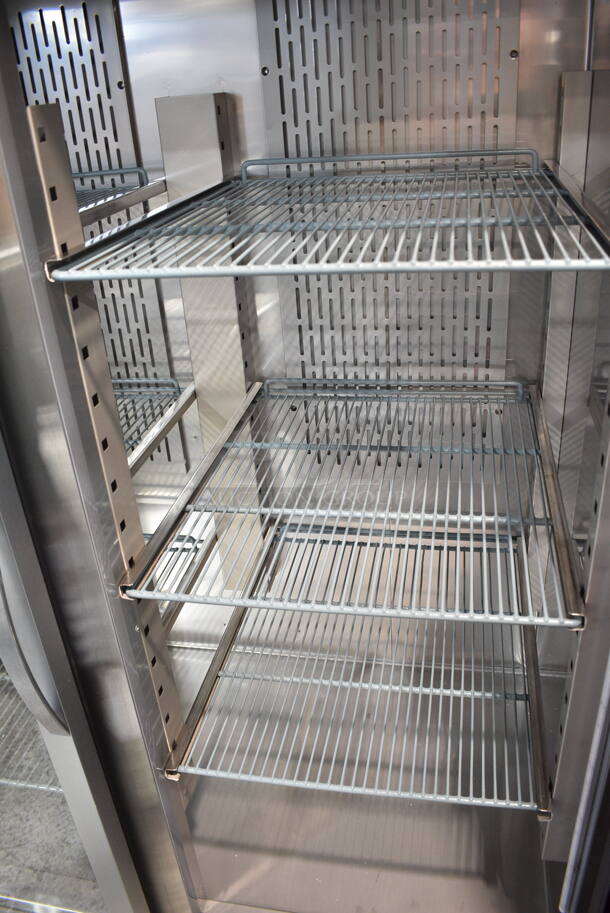 BRAND NEW SCRATCH AND DENT! 2023 Avantco 178Z2RGHC Stainless Steel Commercial 2 Door Reach In Cooler Merchandiser w/ Poly Coated Racks on Commercial Casters. See Pictures for Crack in Right Door. 115 Volts, 1 Phase. Tested and Powers On But Does Not Get Cold - Image 6 of 7