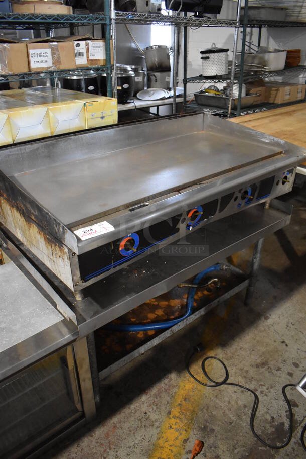Star Stainless Steel Commercial Natural Gas Powered Flat Top Griddle on Stainless Steel Equipment Stand w/ Gas Hose. 48x30x40