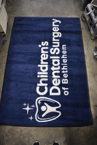 Blue Floor Rug w/ Children's Dental Surgery Logo. 67x44