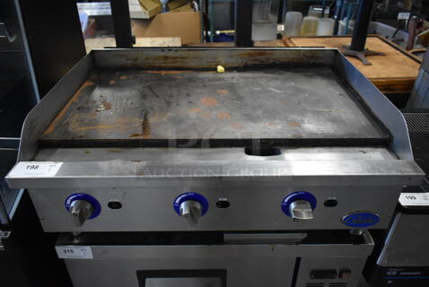 Globe Stainless Steel Commercial Countertop Gas Powered Flat Top Griddle.