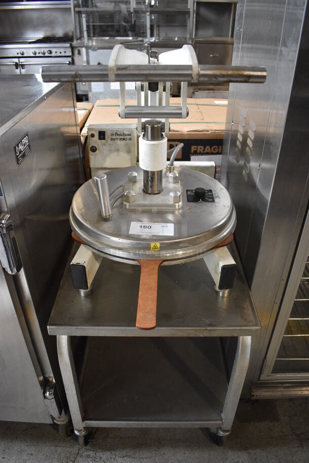 Dutchess DoughXpress Model DMS-18 Metal Commercial Countertop Pizza Dough Press on Metal Equipment Stand w/ Commercial Casters. Comes w/ Pizza Peel. 120 Volts, 1 Phase. 21x36x50.5. Tested and Working!