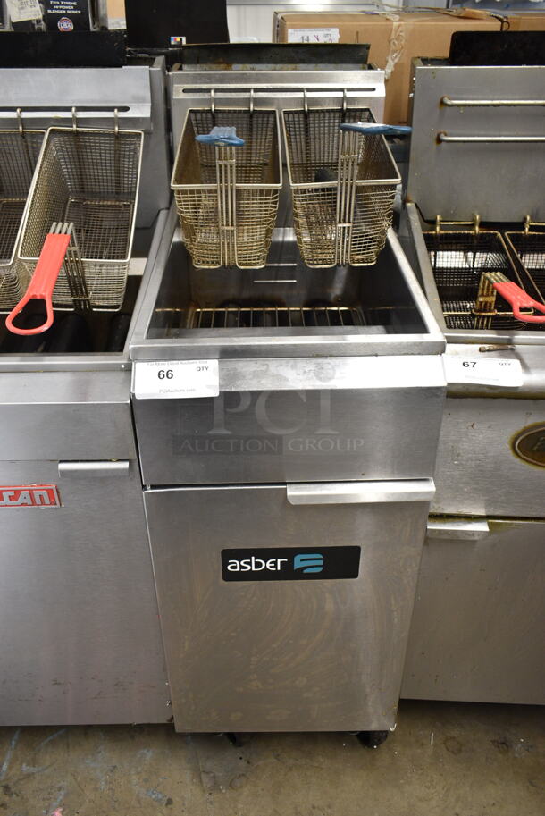 2019 Asber AEF40-50 Stainless Steel Commercial Floor Style Natural Gas Powered Deep Fat Fryer w/ 2 Metal Fry Baskets on Commercial Casters. 114,000 BTU.  - Image 1 of 5